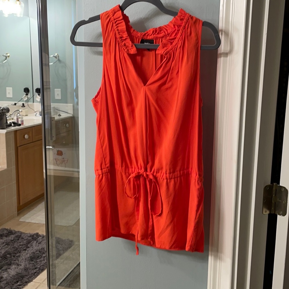 Orange sleeveless shirt